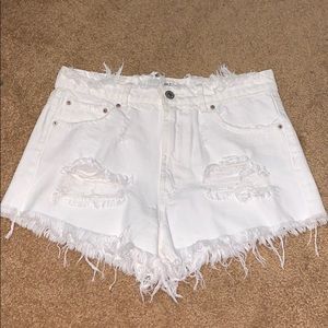 Ripped white jean shorts